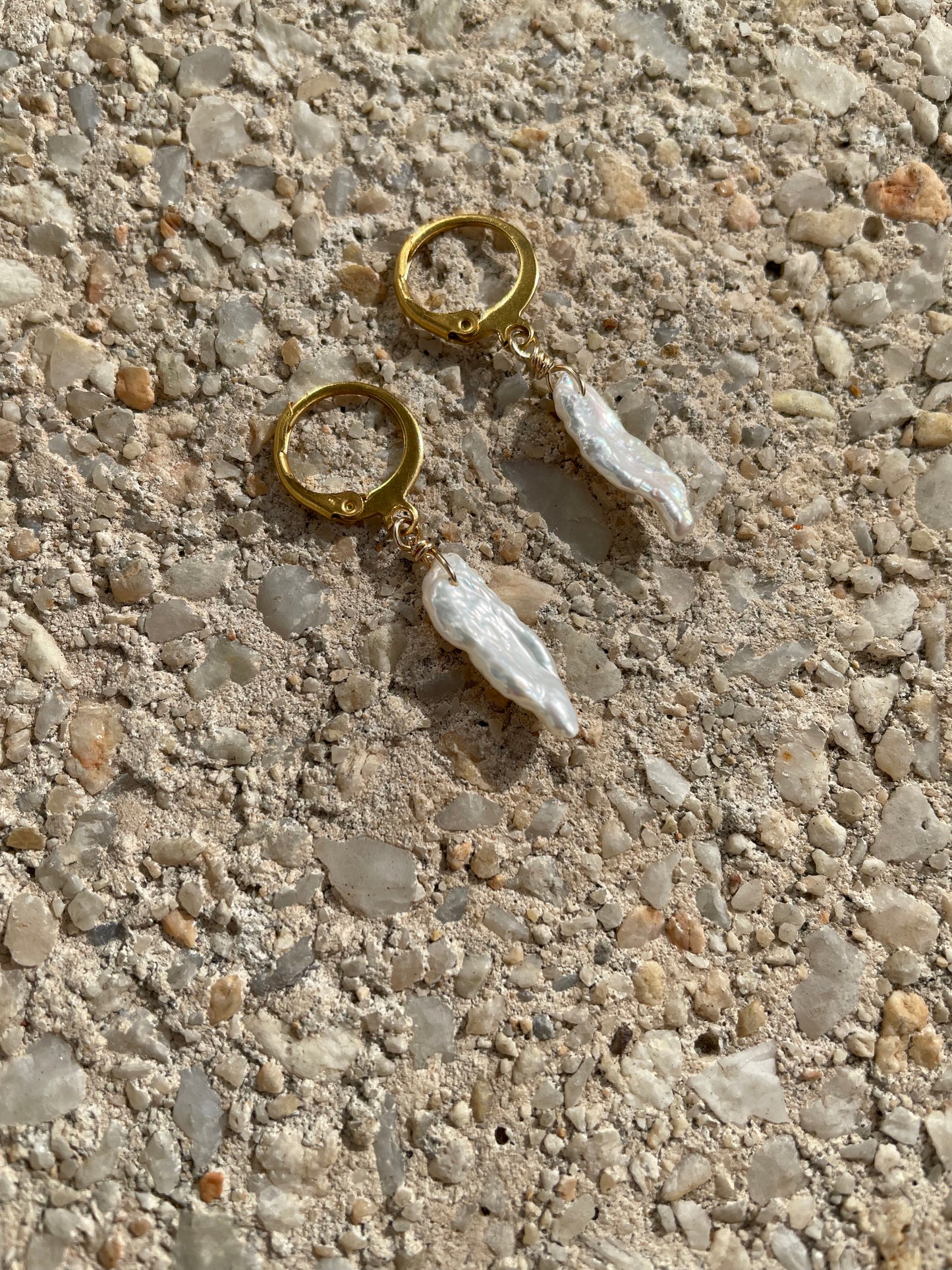 Long white baroque pearl earrings